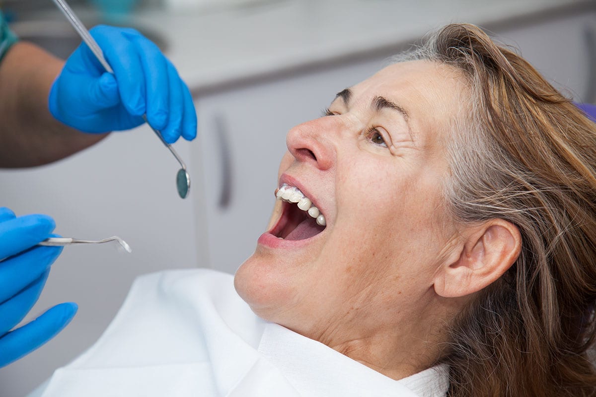 a woman talking to her doctor about Gingivitis Treatment Rogers Arkansas