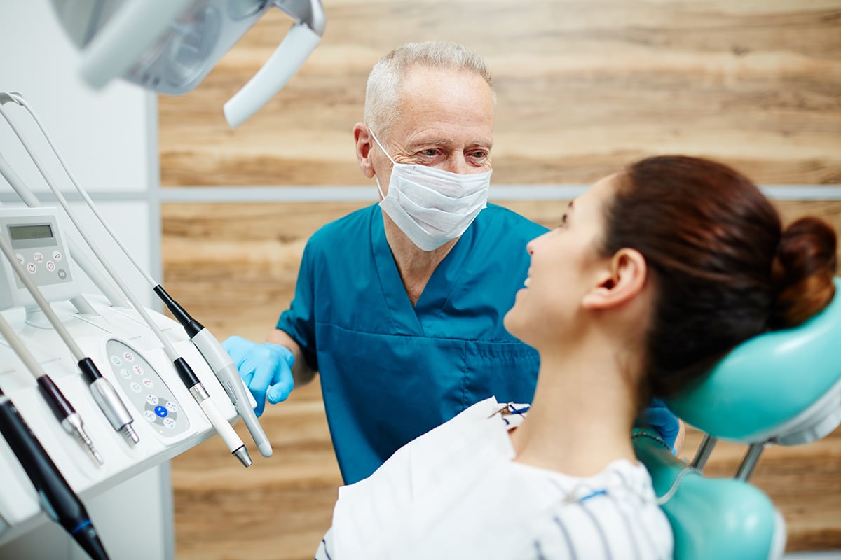 a doctor telling a patient tips for caring for your teeth