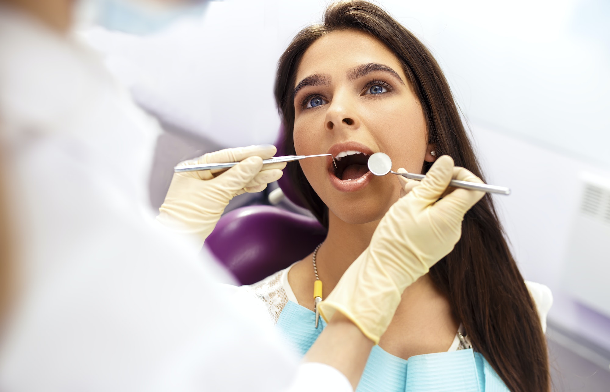 Overview of dental caries prevention. Woman at dentist's chair during dental procedure.Healthy Smile